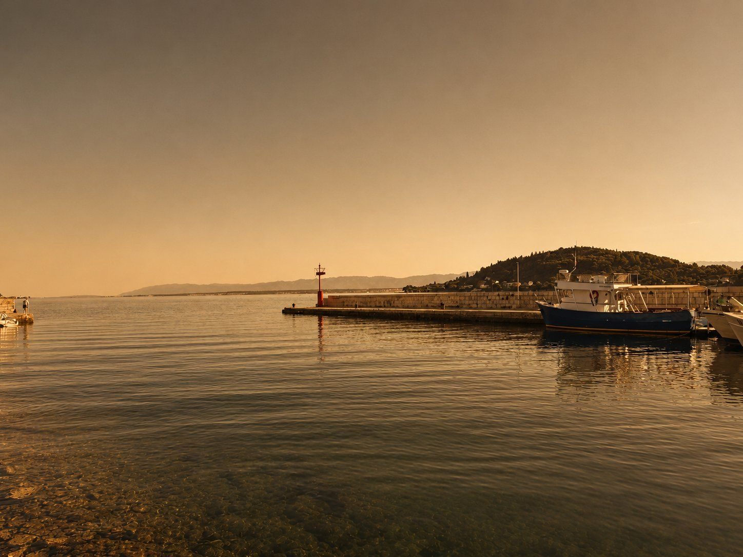 Fishing boats and nets in Kali harbour at first light